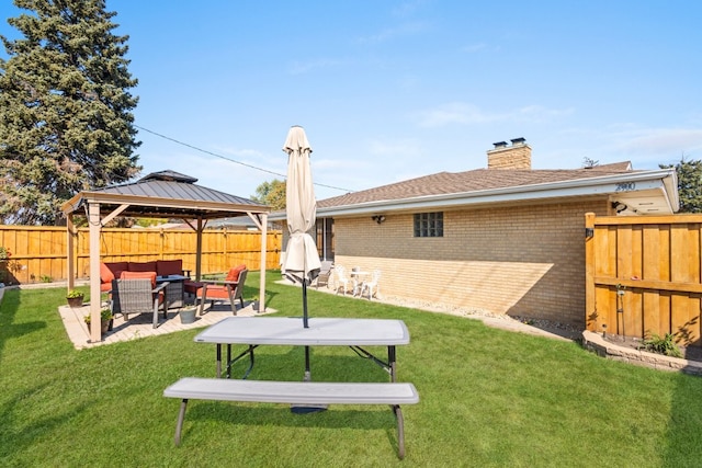 view of yard featuring an outdoor living space and a gazebo