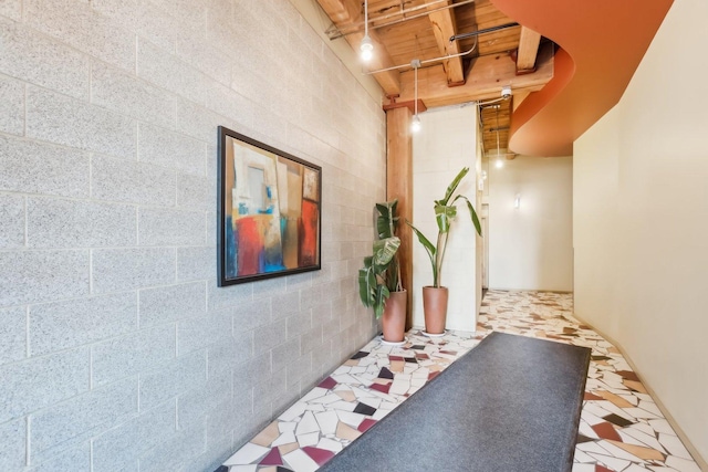 hallway with wooden ceiling and beamed ceiling