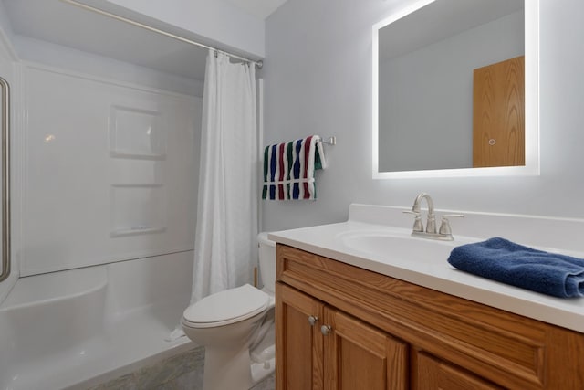 bathroom with vanity, toilet, and curtained shower