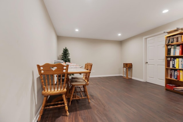 dining area with dark hardwood / wood-style floors