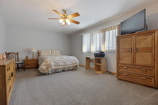 bedroom with light colored carpet and ceiling fan