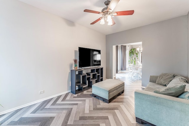 living room featuring ceiling fan and light parquet floors