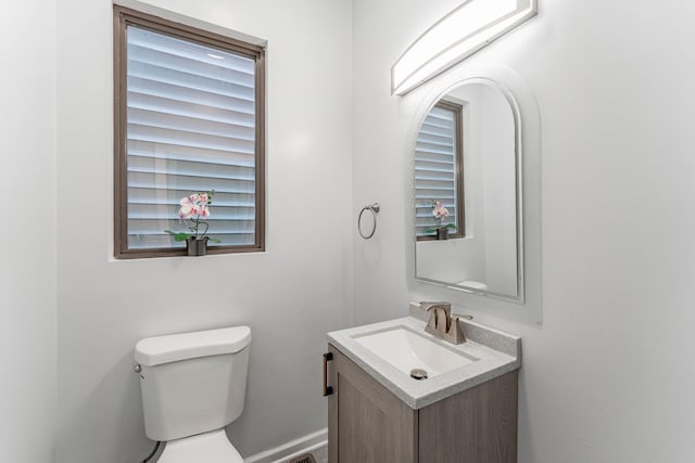 bathroom featuring toilet and vanity