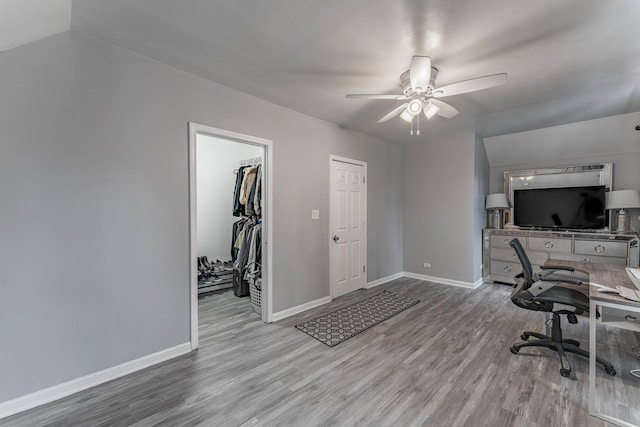 office space featuring ceiling fan and light hardwood / wood-style flooring