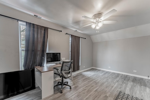 office space with lofted ceiling, ceiling fan, and light wood-type flooring