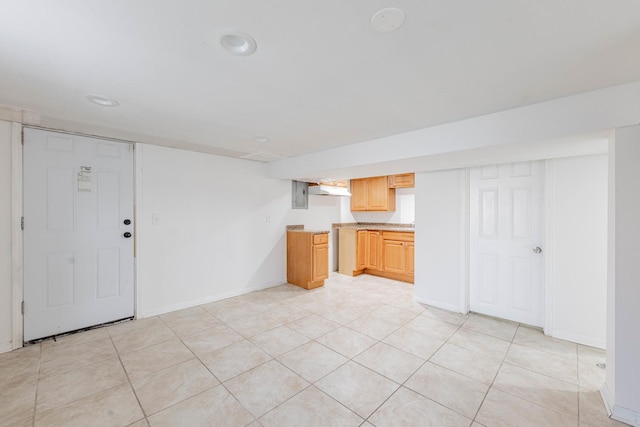 unfurnished living room featuring light tile patterned flooring