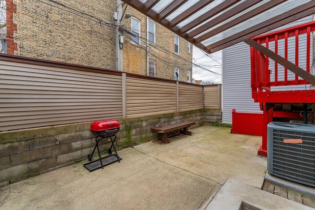 view of patio featuring area for grilling and cooling unit