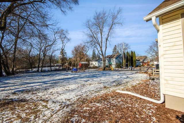 view of yard layered in snow