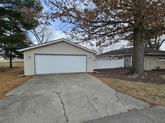 view of front of property featuring an outdoor structure and a garage