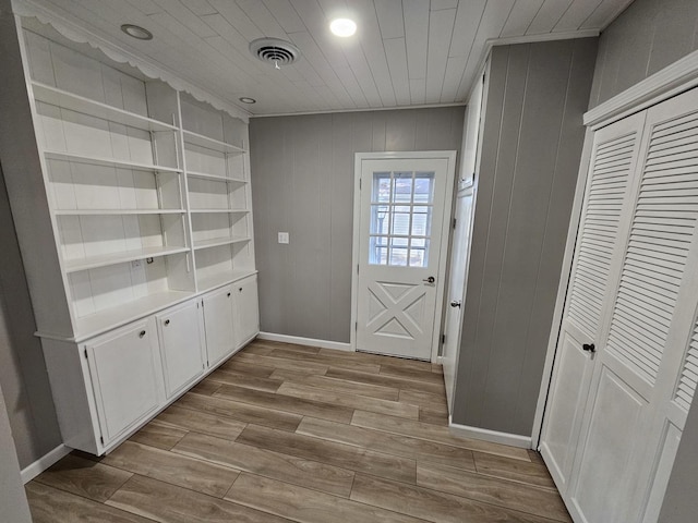 doorway with light hardwood / wood-style floors