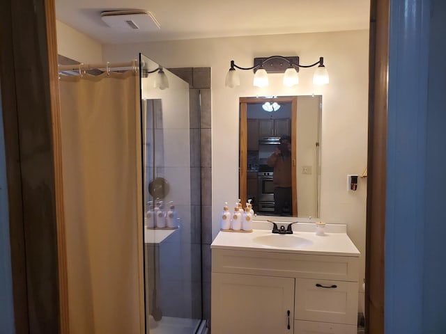 bathroom with vanity and walk in shower