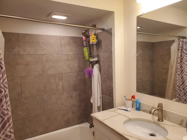 bathroom featuring vanity and shower / bath combo with shower curtain