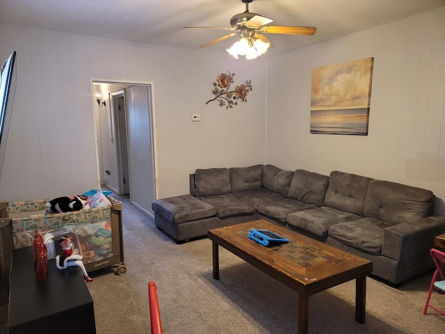 carpeted living room featuring ceiling fan