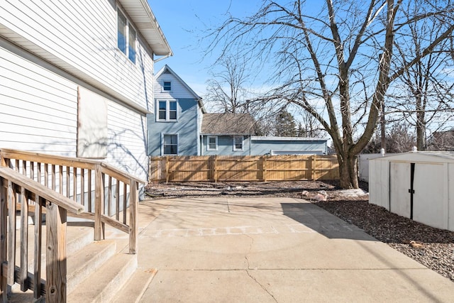 view of patio with a storage unit