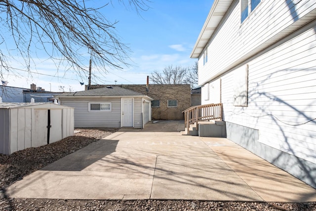 view of patio with a storage unit