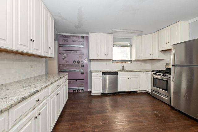 kitchen featuring dark wood-type flooring, sink, light stone counters, stainless steel appliances, and white cabinets