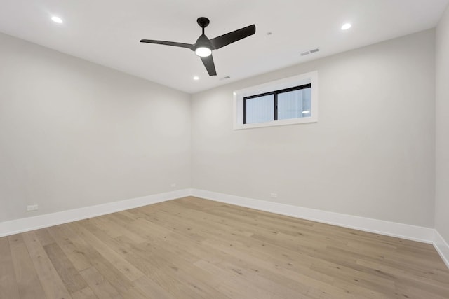 empty room featuring visible vents, recessed lighting, light wood finished floors, baseboards, and ceiling fan