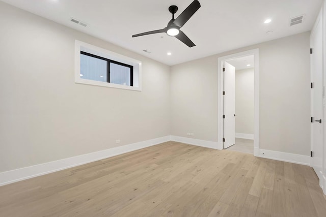 unfurnished room with light wood finished floors, visible vents, recessed lighting, and baseboards