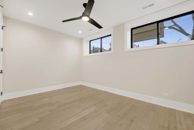 empty room with light wood finished floors, visible vents, baseboards, ceiling fan, and recessed lighting