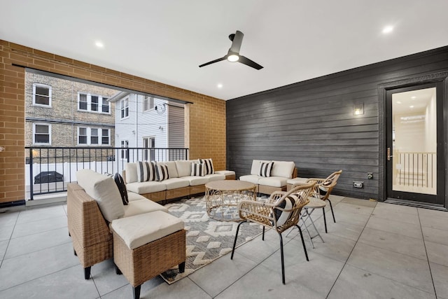 view of patio / terrace featuring outdoor lounge area, a balcony, and ceiling fan