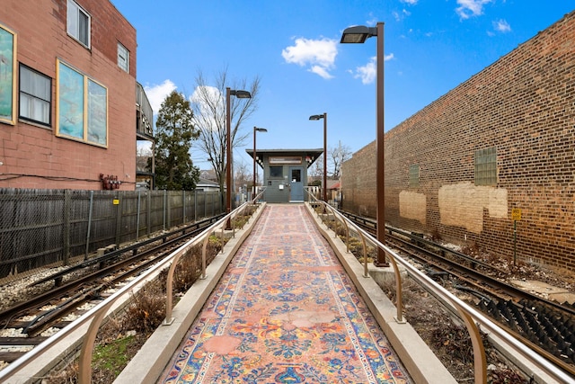 view of property's community featuring fence