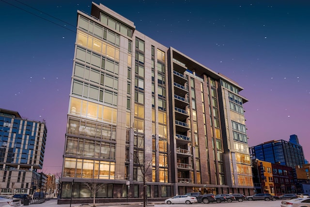 view of outdoor building at dusk