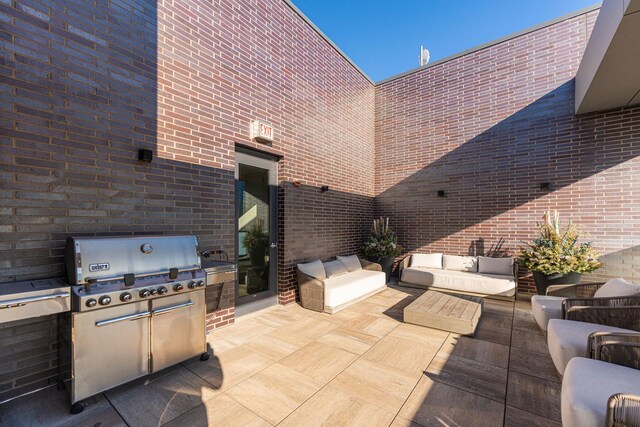 view of patio / terrace featuring area for grilling, outdoor lounge area, and exterior kitchen