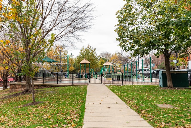 view of home's community featuring a playground and a lawn