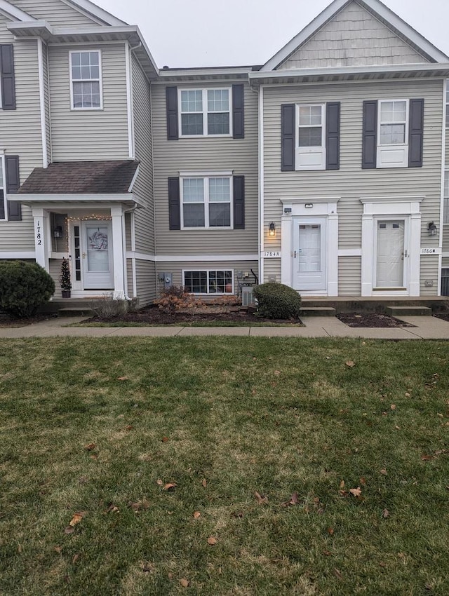 view of property featuring a front yard