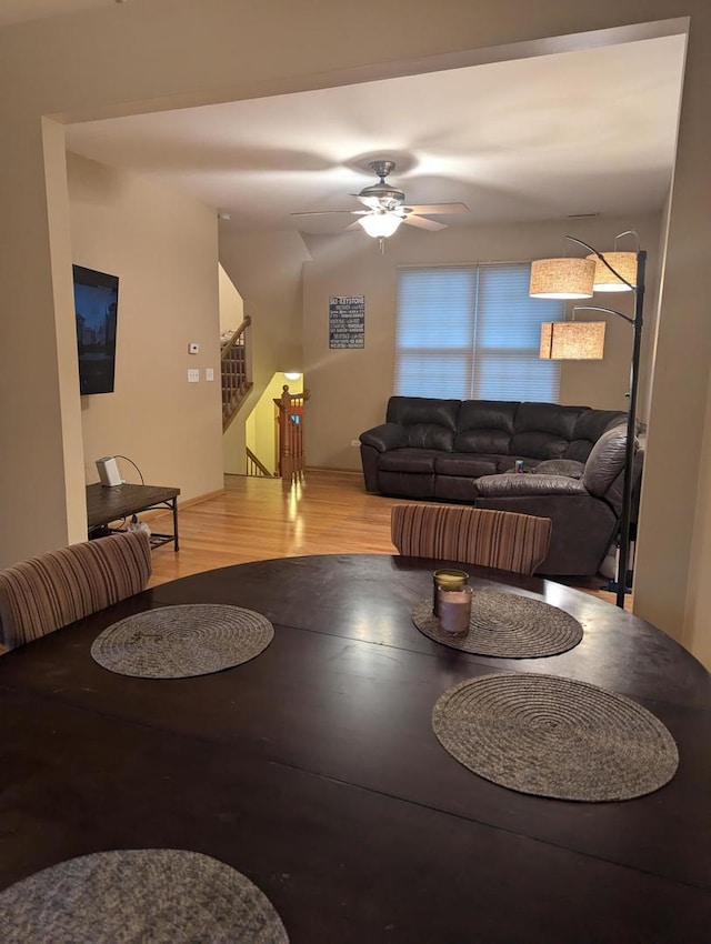 living room with ceiling fan and hardwood / wood-style flooring