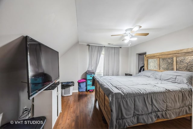 bedroom featuring ceiling fan, vaulted ceiling, and dark hardwood / wood-style floors