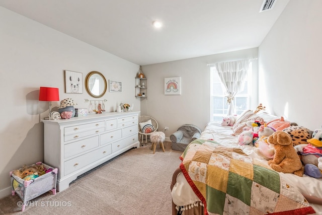 bedroom featuring light carpet