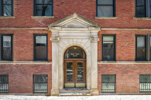 view of snow covered property entrance