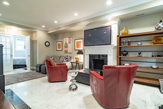 living room featuring ornamental molding and a fireplace