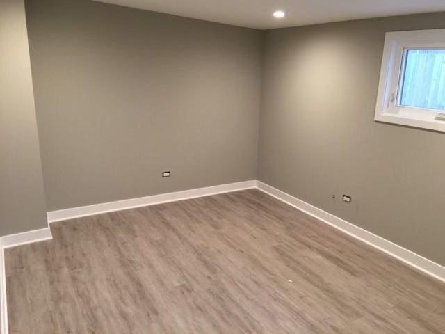 empty room with wood-type flooring