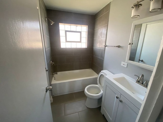 full bathroom with toilet, tiled shower / bath combo, tile patterned floors, and vanity