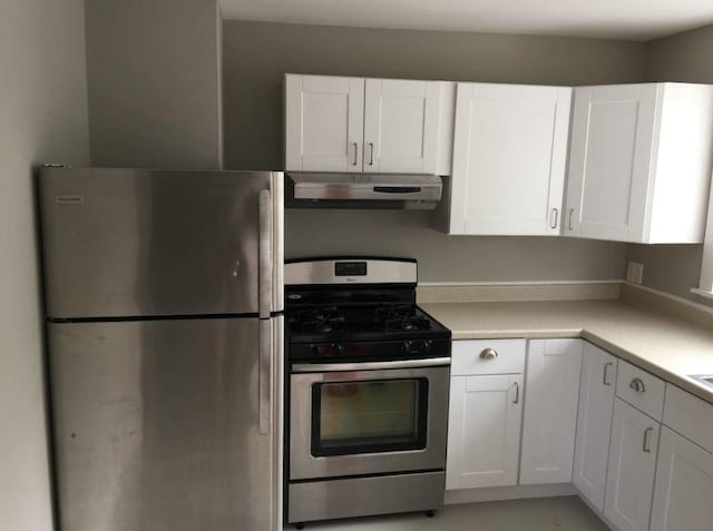 kitchen with appliances with stainless steel finishes and white cabinetry