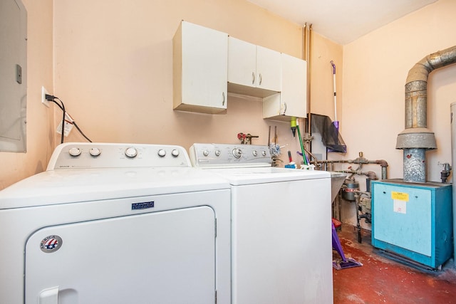 clothes washing area with cabinets and independent washer and dryer