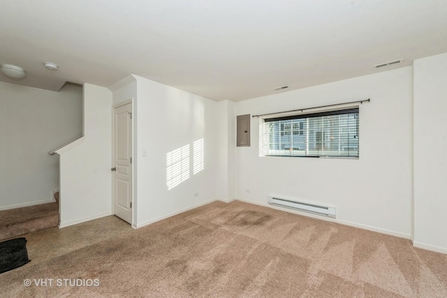 carpeted spare room with electric panel and baseboard heating