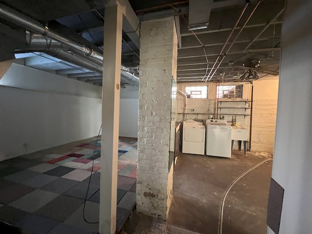 basement with independent washer and dryer and sink