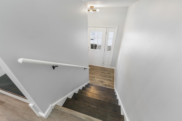 stairway featuring hardwood / wood-style floors