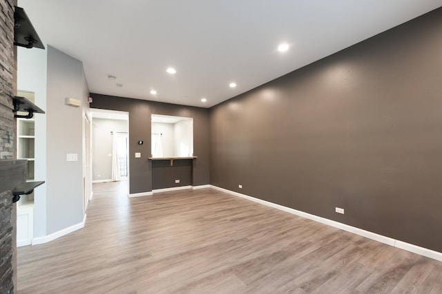 unfurnished living room with light wood-type flooring