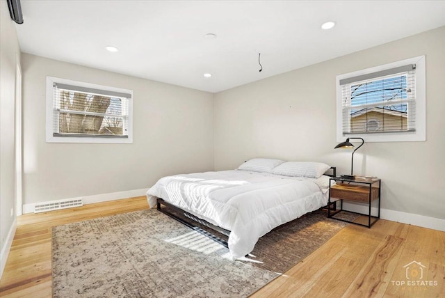 bedroom with light wood-type flooring