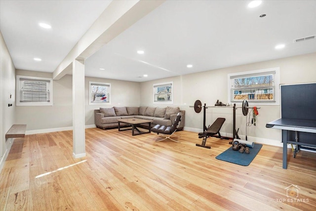 exercise area featuring light hardwood / wood-style flooring