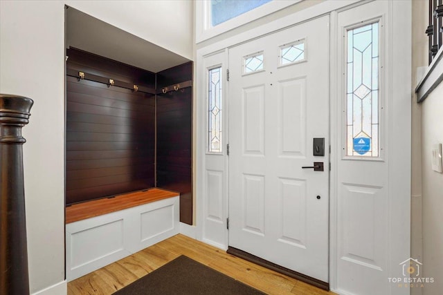 mudroom with light hardwood / wood-style floors