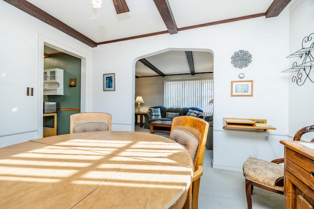 carpeted bedroom featuring beam ceiling