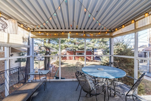 sunroom / solarium featuring a healthy amount of sunlight