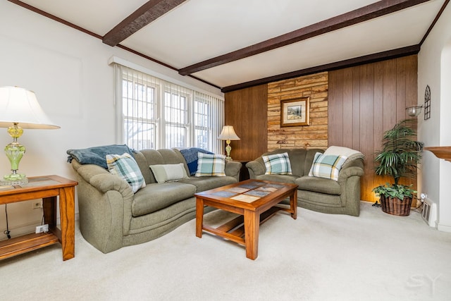 carpeted living room featuring wood walls and beam ceiling