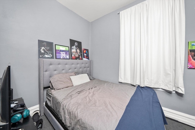 bedroom with carpet and lofted ceiling