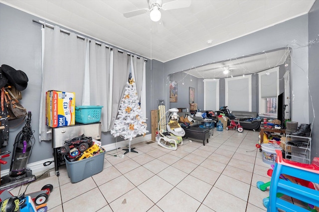 interior space featuring ceiling fan and light tile patterned floors